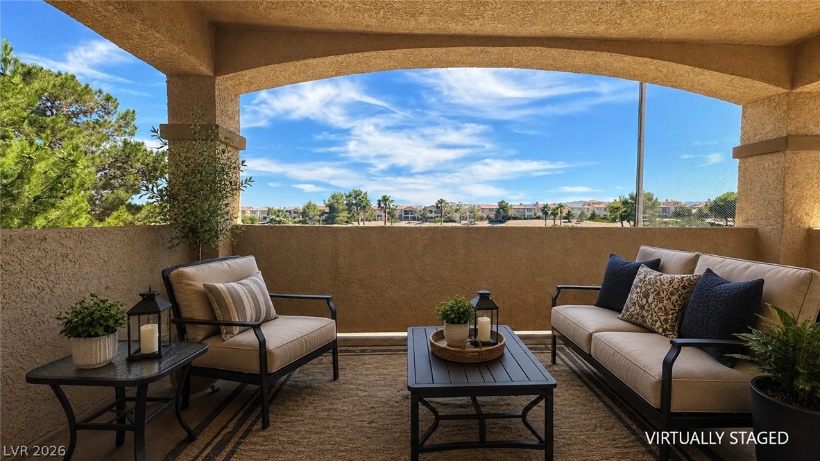 87 Tall Ruff Drive Las Vegas, NV 89148 - Photo 31 of 71 Relax on the covered balcony, enjoying scenic views and serene outdoor living.