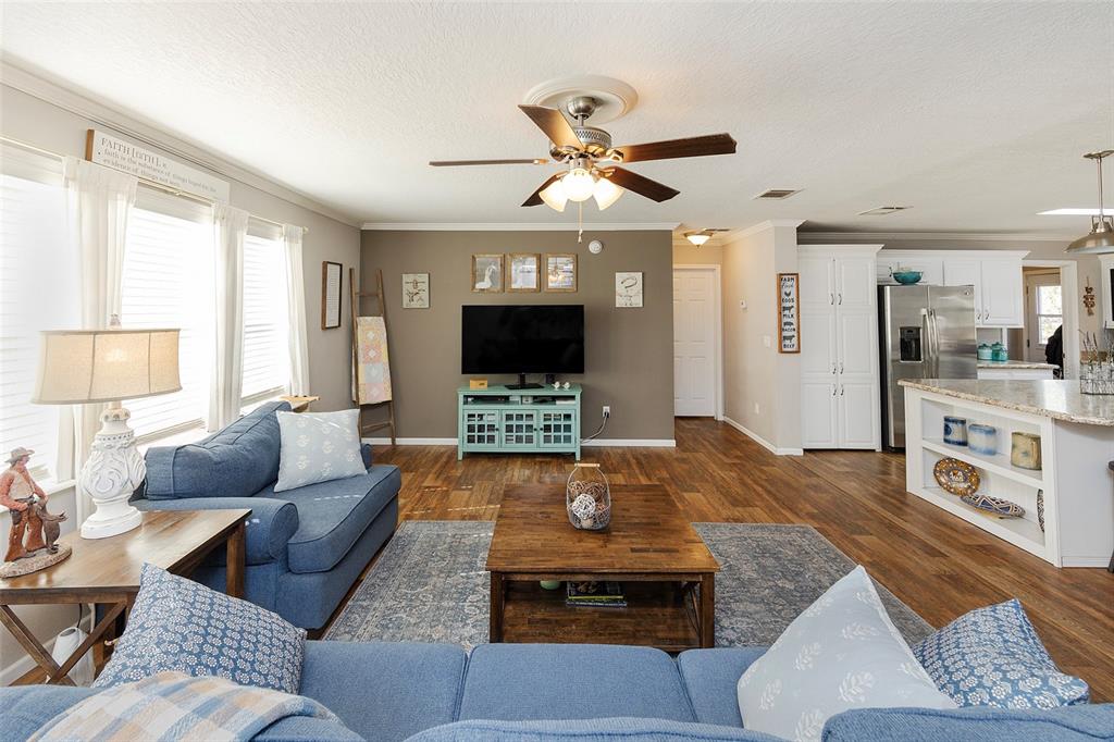 2100 East Kicklighter Road Lake Helen, FL 32744 - Photo 18 of 61 a living room with furniture and a flat screen tv