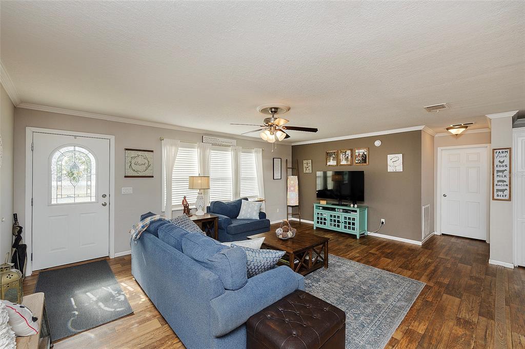 2100 East Kicklighter Road Lake Helen, FL 32744 - Photo 20 of 61 a living room with furniture and a flat screen tv