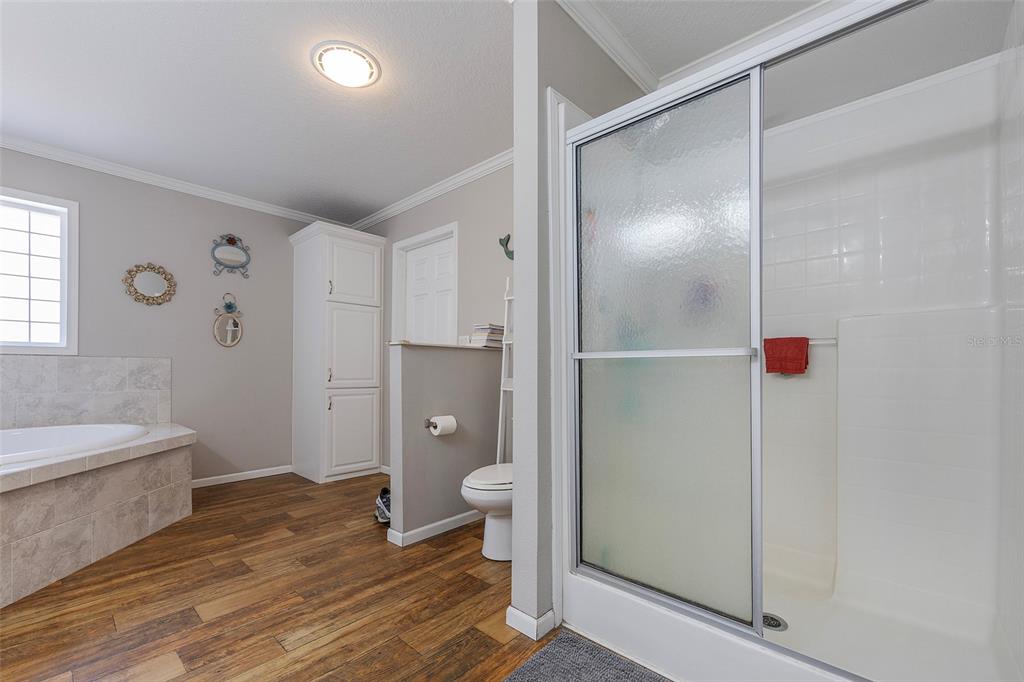 2100 East Kicklighter Road Lake Helen, FL 32744 - Photo 32 of 61 a bathroom with a shower and a toilet