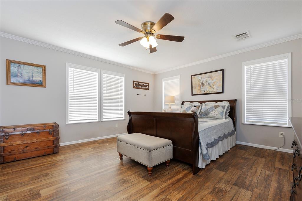 2100 East Kicklighter Road Lake Helen, FL 32744 - Photo 37 of 61 a bedroom with a bed and window