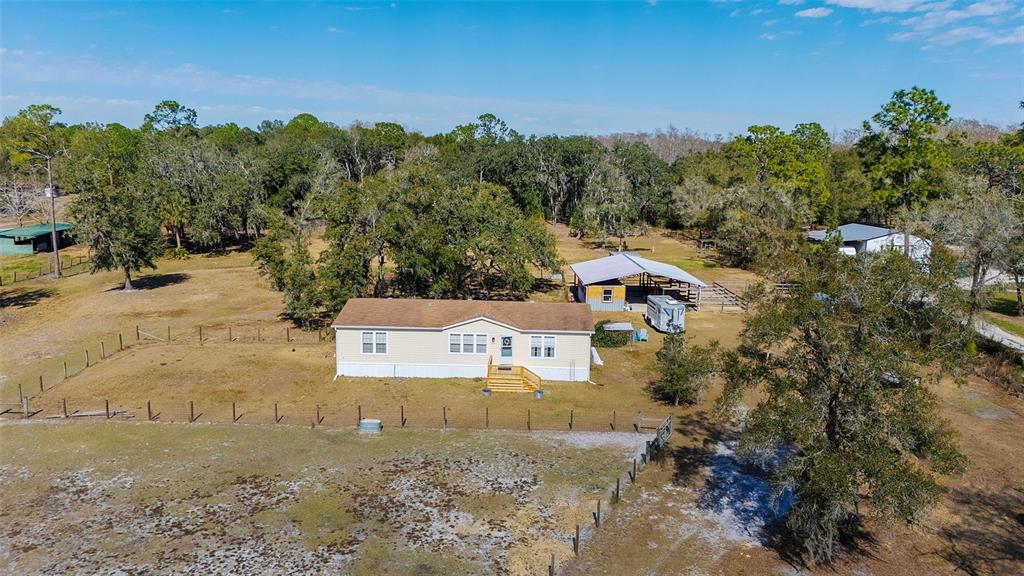 2100 East Kicklighter Road Lake Helen, FL 32744 - Photo 4 of 61 a aerial view of a house with a yard