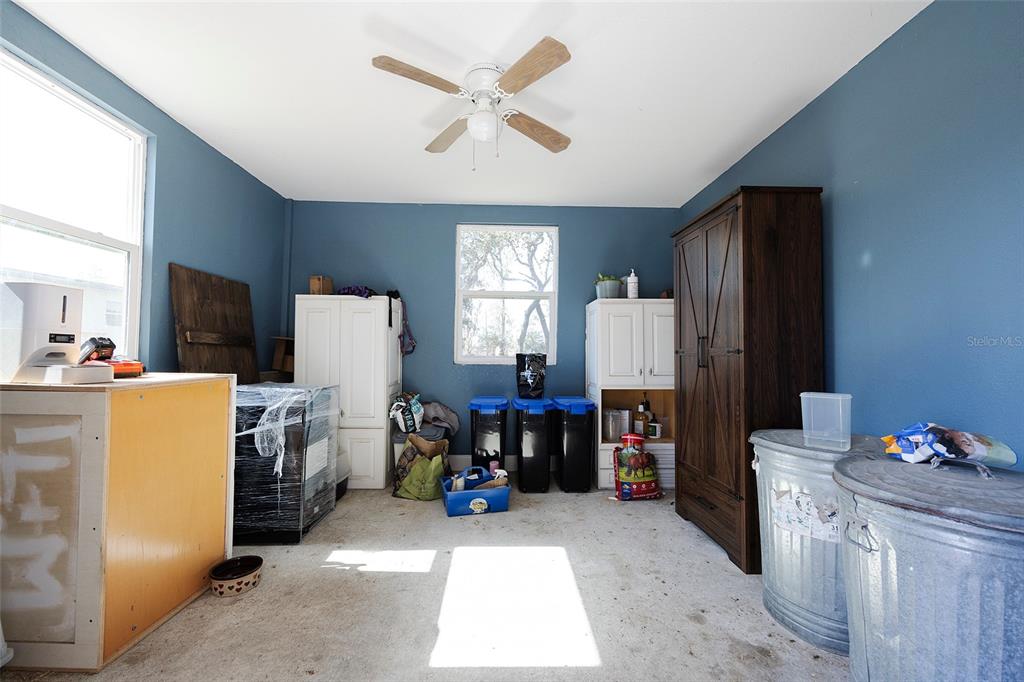 2100 East Kicklighter Road Lake Helen, FL 32744 - Photo 46 of 61 a bed room with furniture and a window