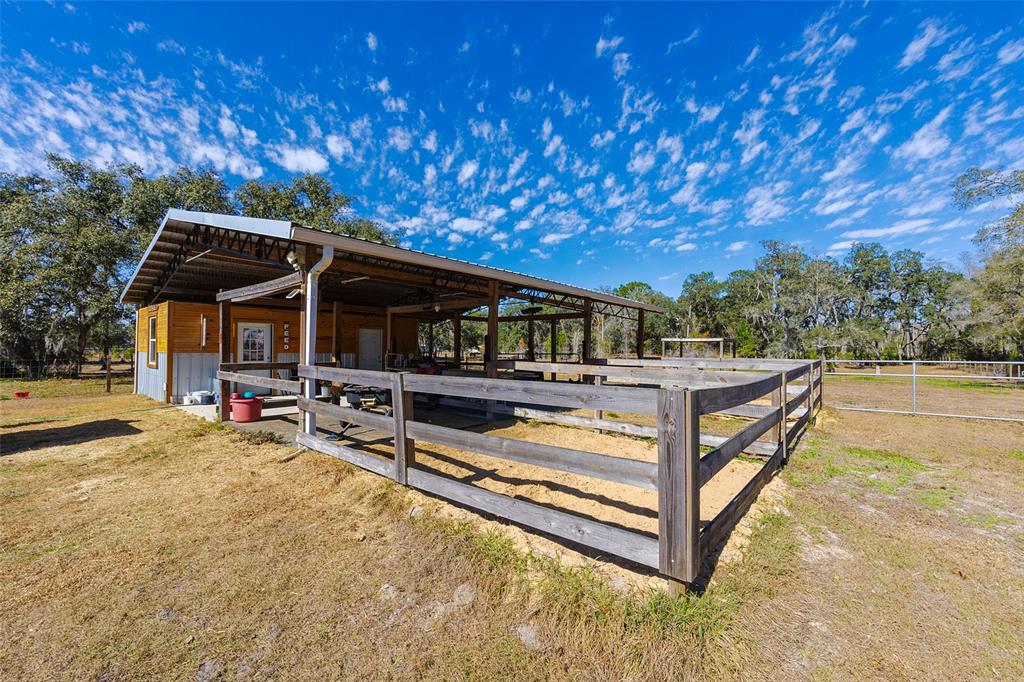 2100 East Kicklighter Road Lake Helen, FL 32744 - Photo 47 of 61 a view of a house with swimming pool and sitting area