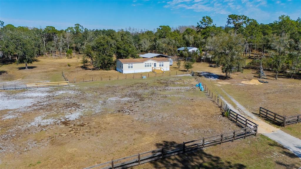 2100 East Kicklighter Road Lake Helen, FL 32744 - Photo 51 of 61 a view of a dry yard with wooden fence