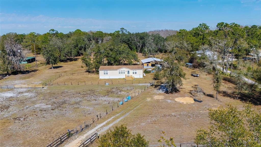 2100 East Kicklighter Road Lake Helen, FL 32744 - Photo 52 of 61 a view of a yard with horses