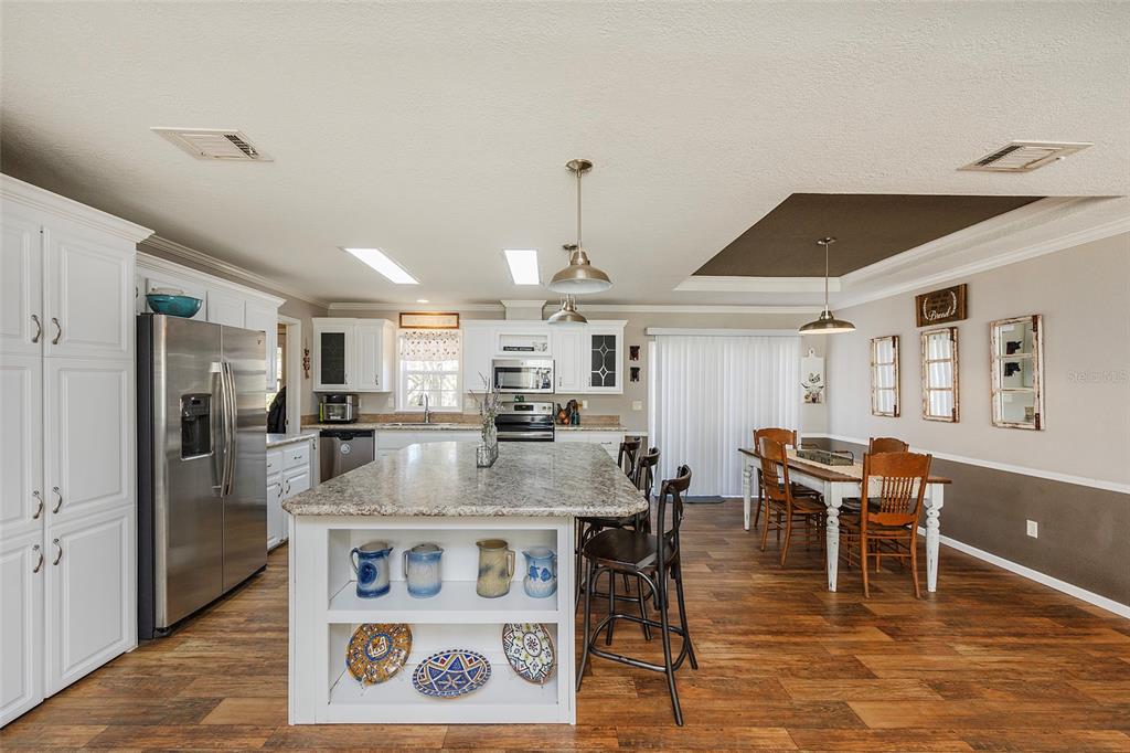 2100 East Kicklighter Road Lake Helen, FL 32744 - Photo 7 of 61 a view of a dining room with furniture