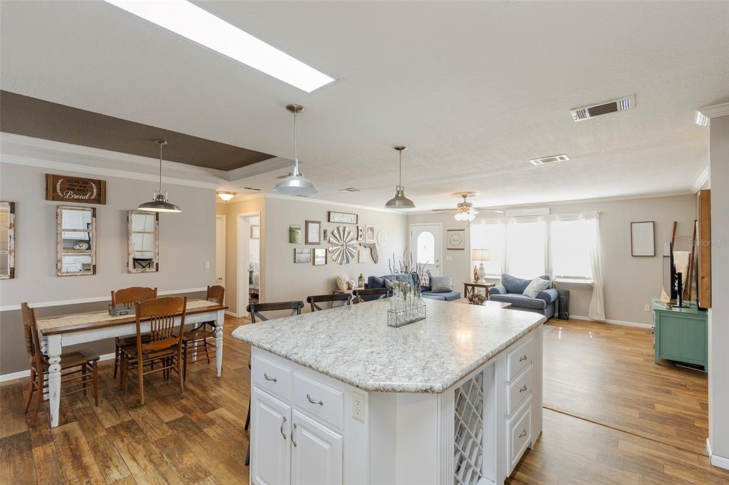 2100 East Kicklighter Road Lake Helen, FL 32744 - Photo 8 of 61 a kitchen with lots of counter top space and dining table