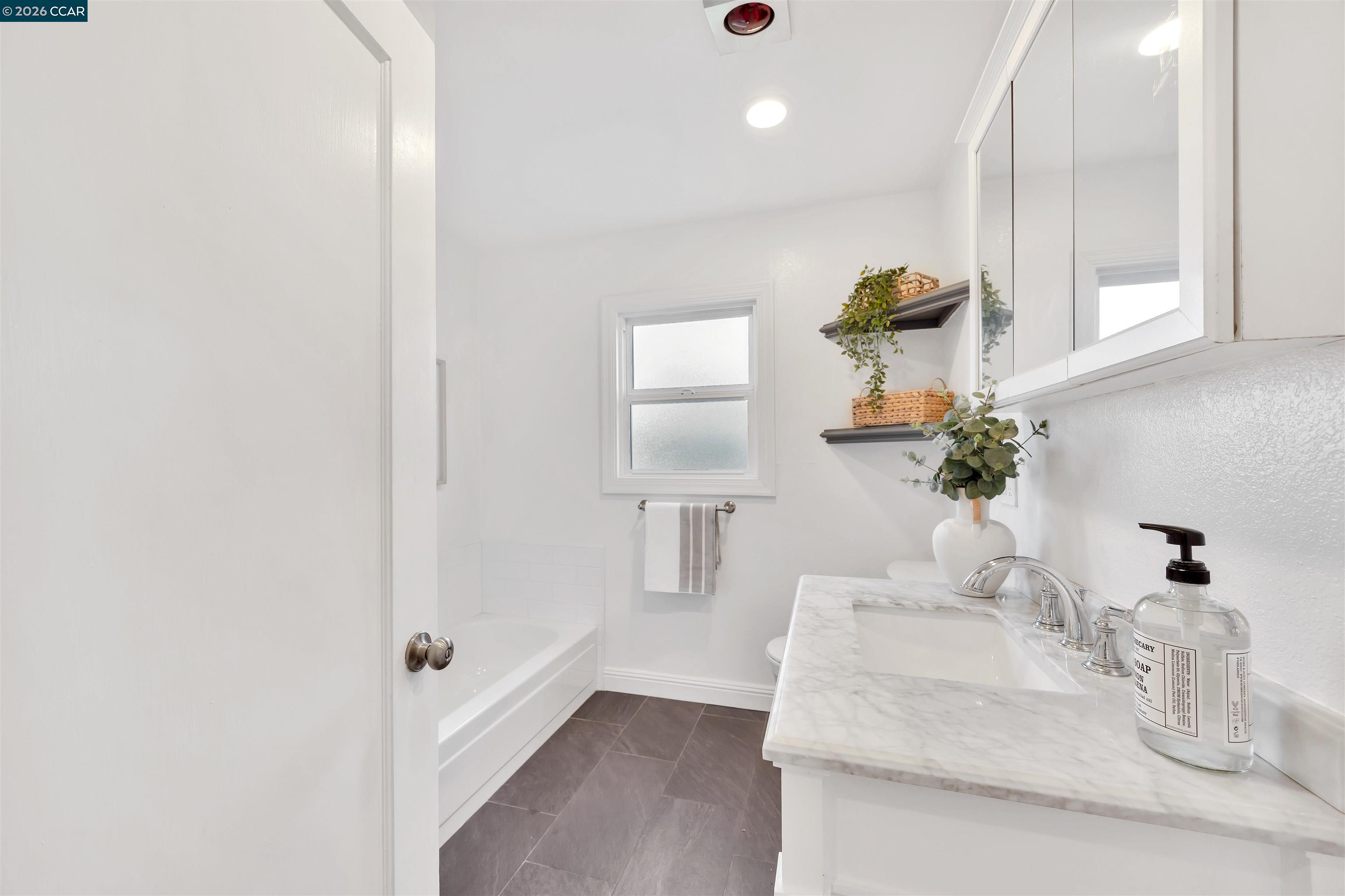 3530 Kevin Place Concord, CA 94519 - Photo 17 of 30 a bathroom with a sink a toilet and mirror