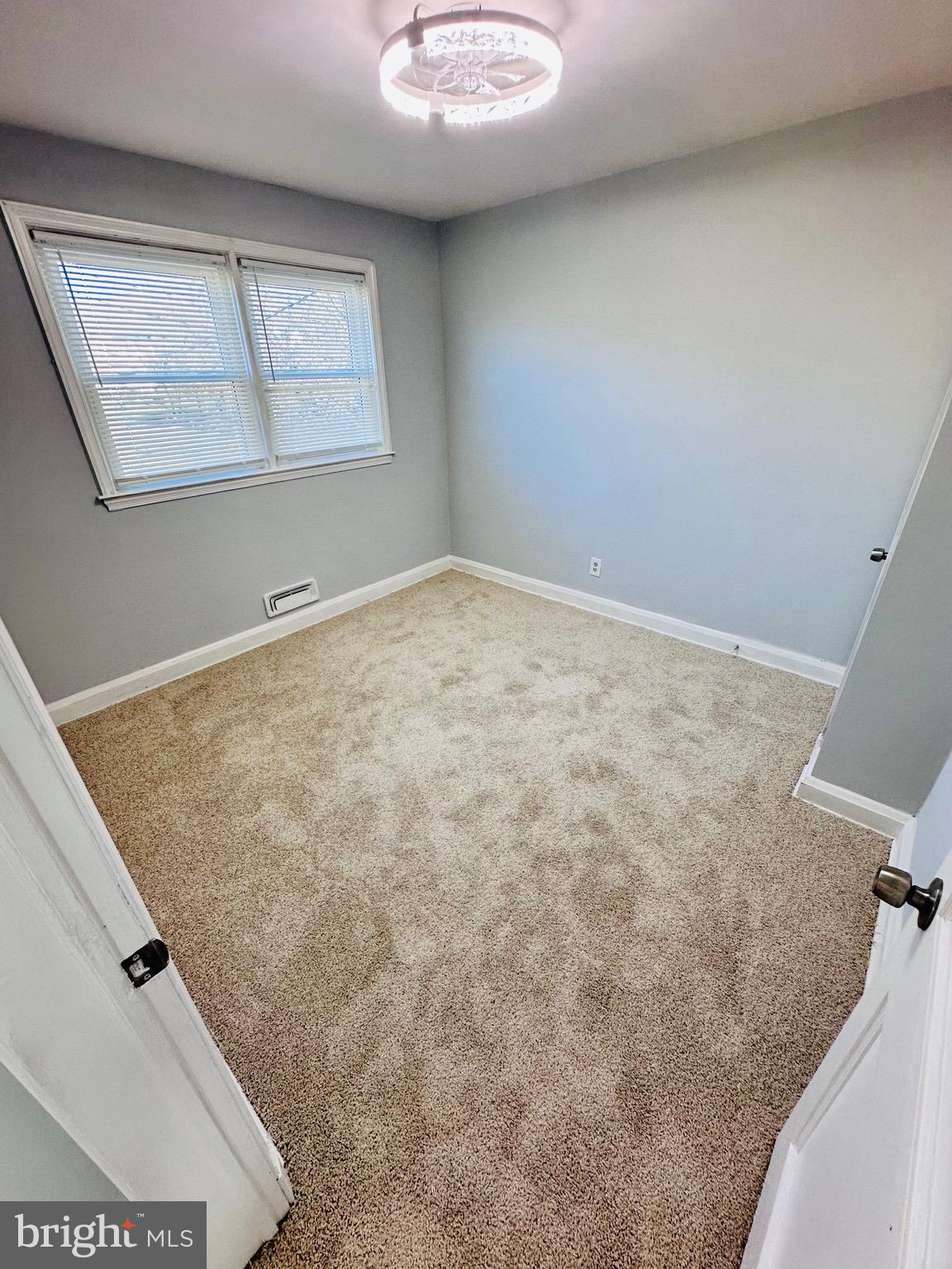 4728 Chatford Avenue Baltimore, MD 21206 - Photo 17 of 36 an empty room with windows