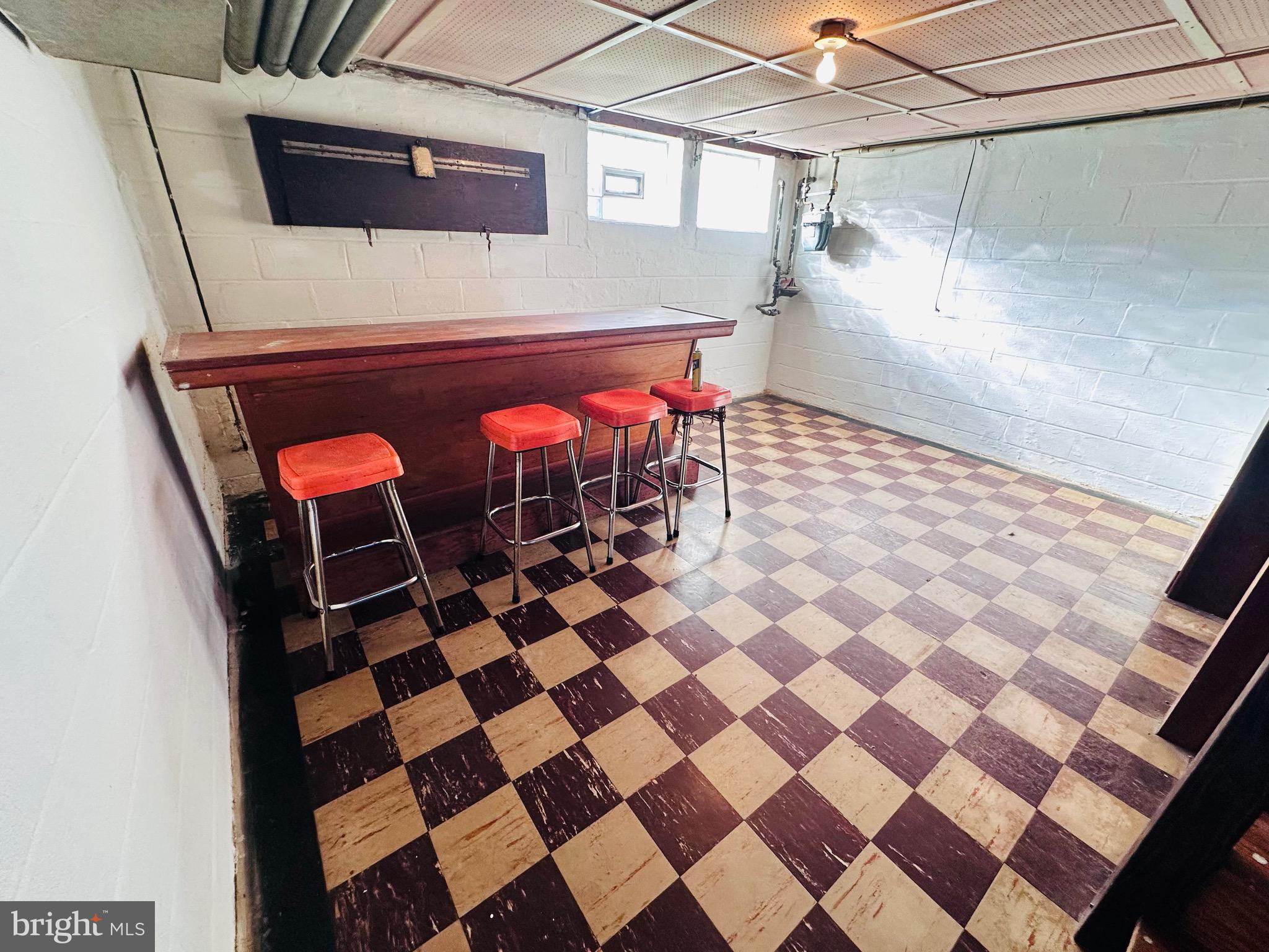 4728 Chatford Avenue Baltimore, MD 21206 - Photo 22 of 36 a room with a black white checkered floor