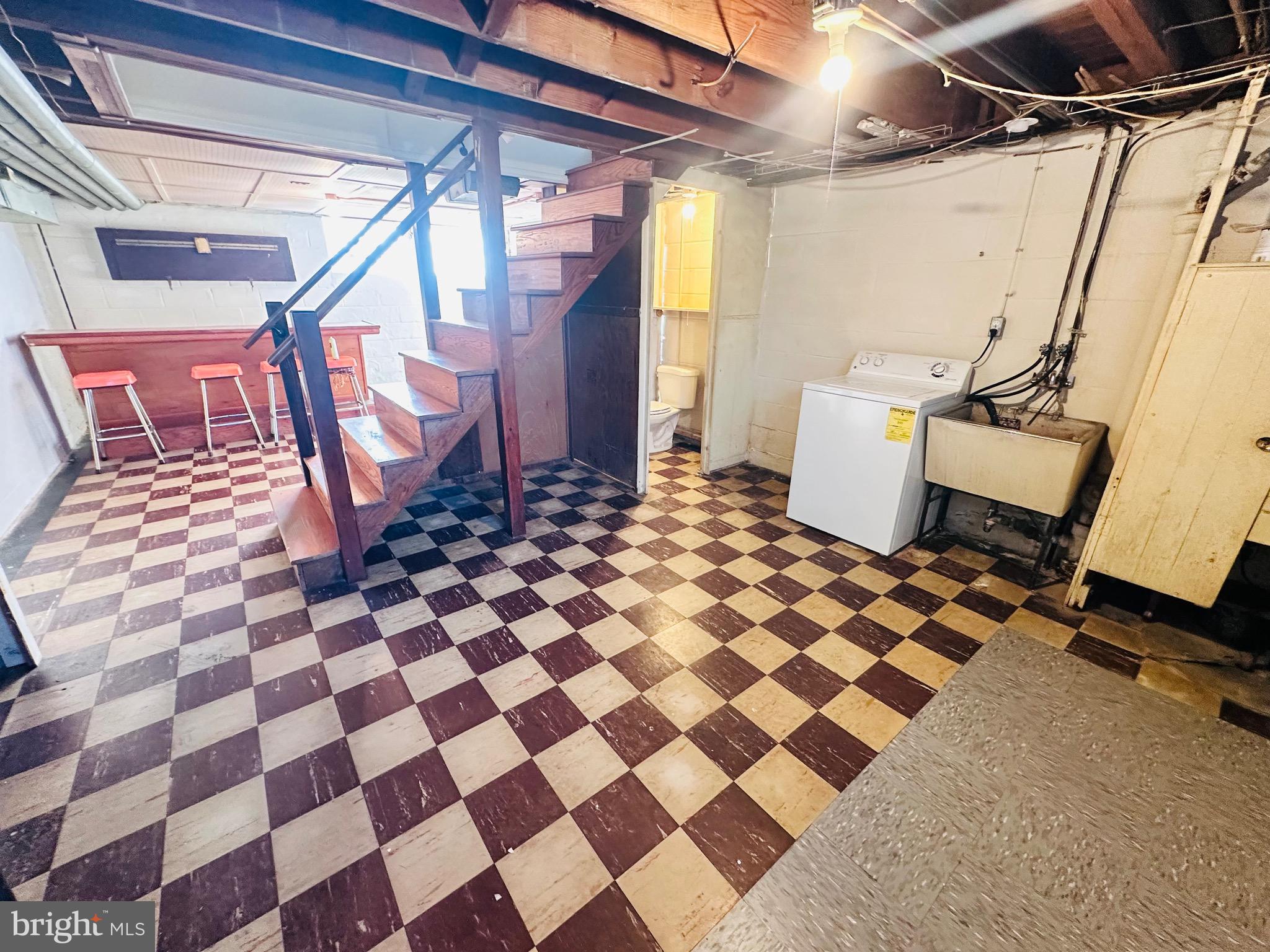 4728 Chatford Avenue Baltimore, MD 21206 - Photo 24 of 36 a bathroom with a black and white checkered floor