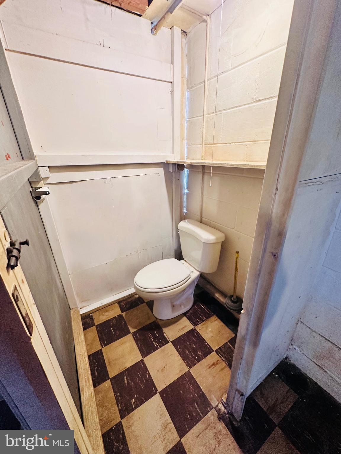 4728 Chatford Avenue Baltimore, MD 21206 - Photo 26 of 36 a bathroom with a toilet and a shower