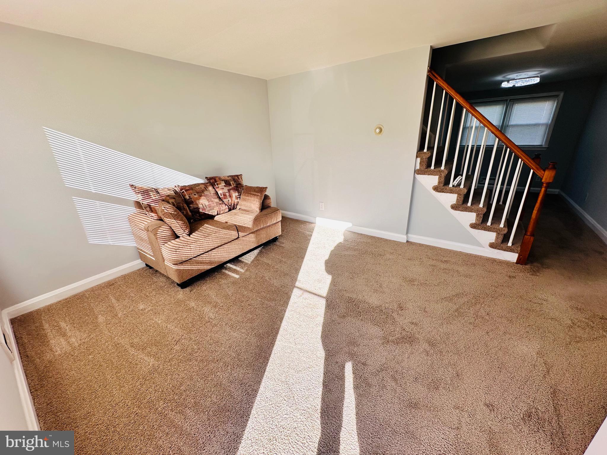 4728 Chatford Avenue Baltimore, MD 21206 - Photo 5 of 36 a view of livingroom with stairs and furniture