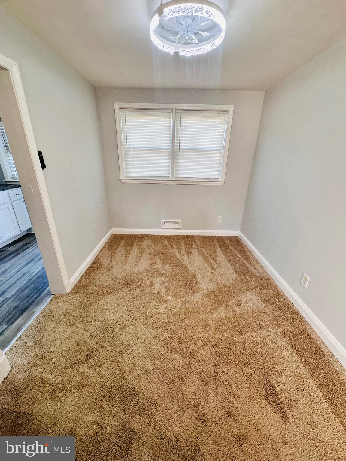 4728 Chatford Avenue Baltimore, MD 21206 - Photo 7 of 36 a view of empty room with wooden floor and fan