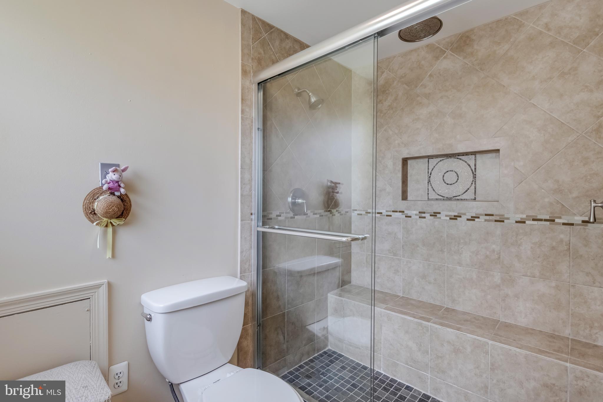 13824 Rippling Brook Drive Silver Spring, MD 20906 - Photo 26 of 39 Primary bath with custom tile and shampoo niche