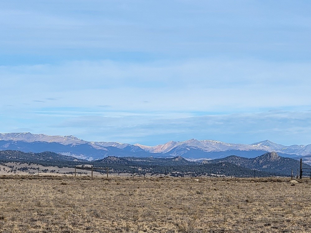 1162 Rocky Mountain Road Hartsel, CO 80449 - Photo 17 of 45 a view of a town with mountains in the background
