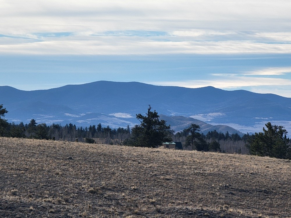 1162 Rocky Mountain Road Hartsel, CO 80449 - Photo 29 of 45 a view of mountains and sunset