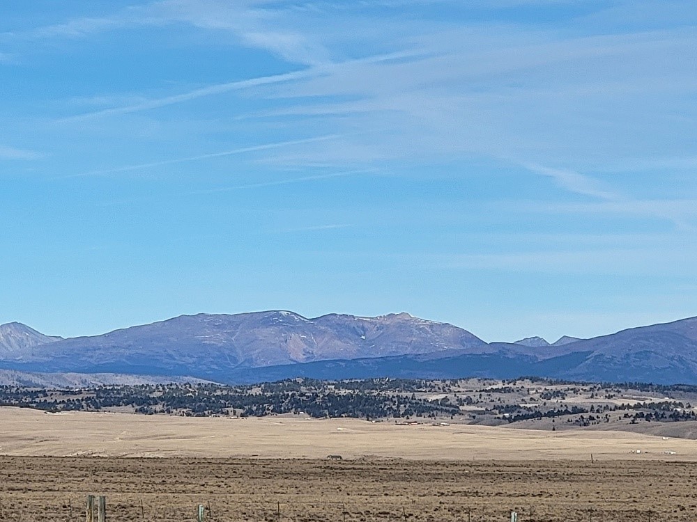 1162 Rocky Mountain Road Hartsel, CO 80449 - Photo 9 of 45 a view of a town with mountains in the background