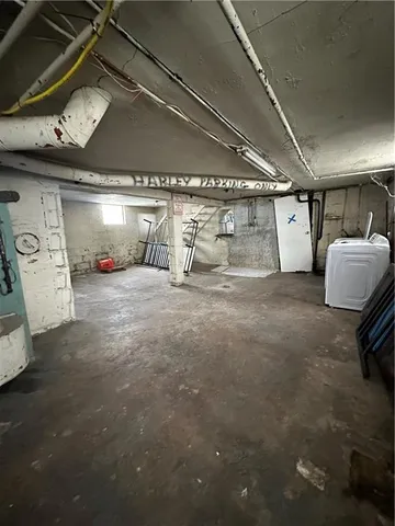 a view of parking garage with cars