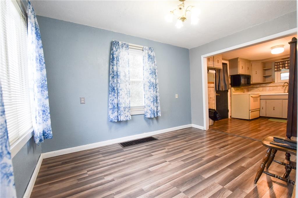 811 Saxonburg Road Butler, PA 16002 - Photo 3 of 13 a view of empty room with wooden floor and fan