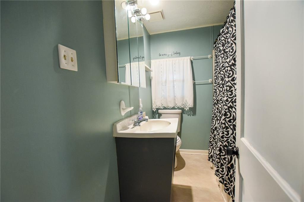 811 Saxonburg Road Butler, PA 16002 - Photo 6 of 13 a bathroom with a sink a mirror and a shower