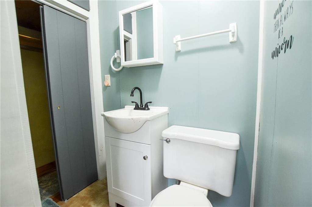 811 Saxonburg Road Butler, PA 16002 - Photo 7 of 13 a bathroom with a toilet sink and mirror