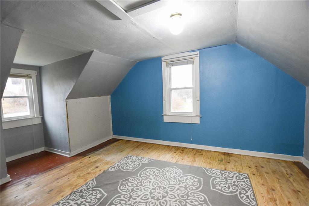 811 Saxonburg Road Butler, PA 16002 - Photo 8 of 13 a view of an empty room with wooden floor and a window