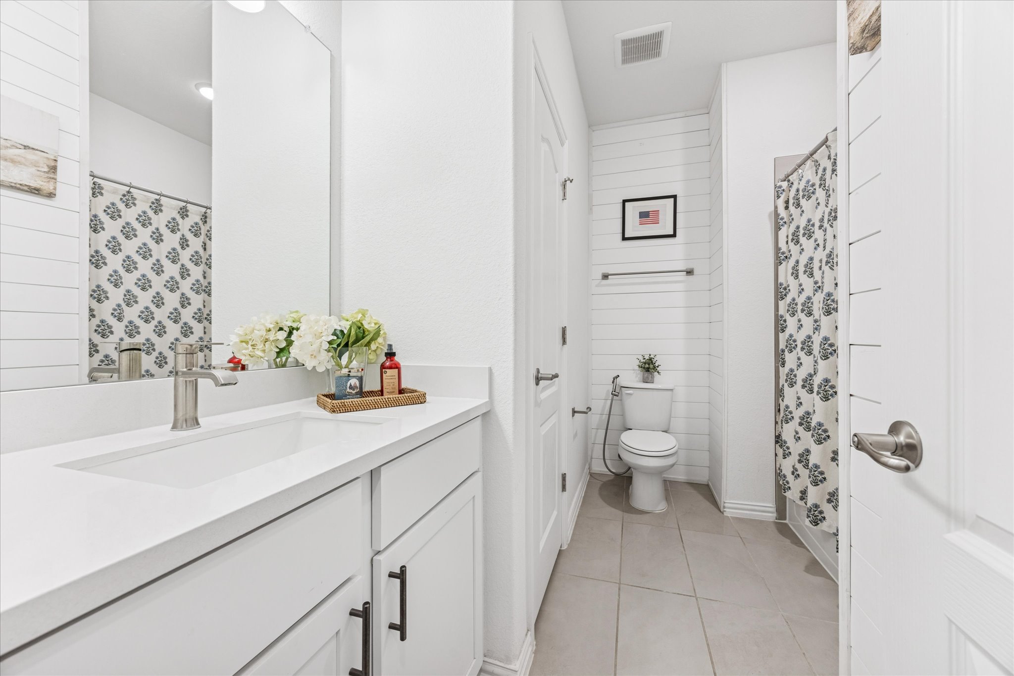 540 Sugar Cane Buda, TX 78610 - Photo 9 of 11 Bathroom featuring curtained shower, vanity, and light tile patterned flooring