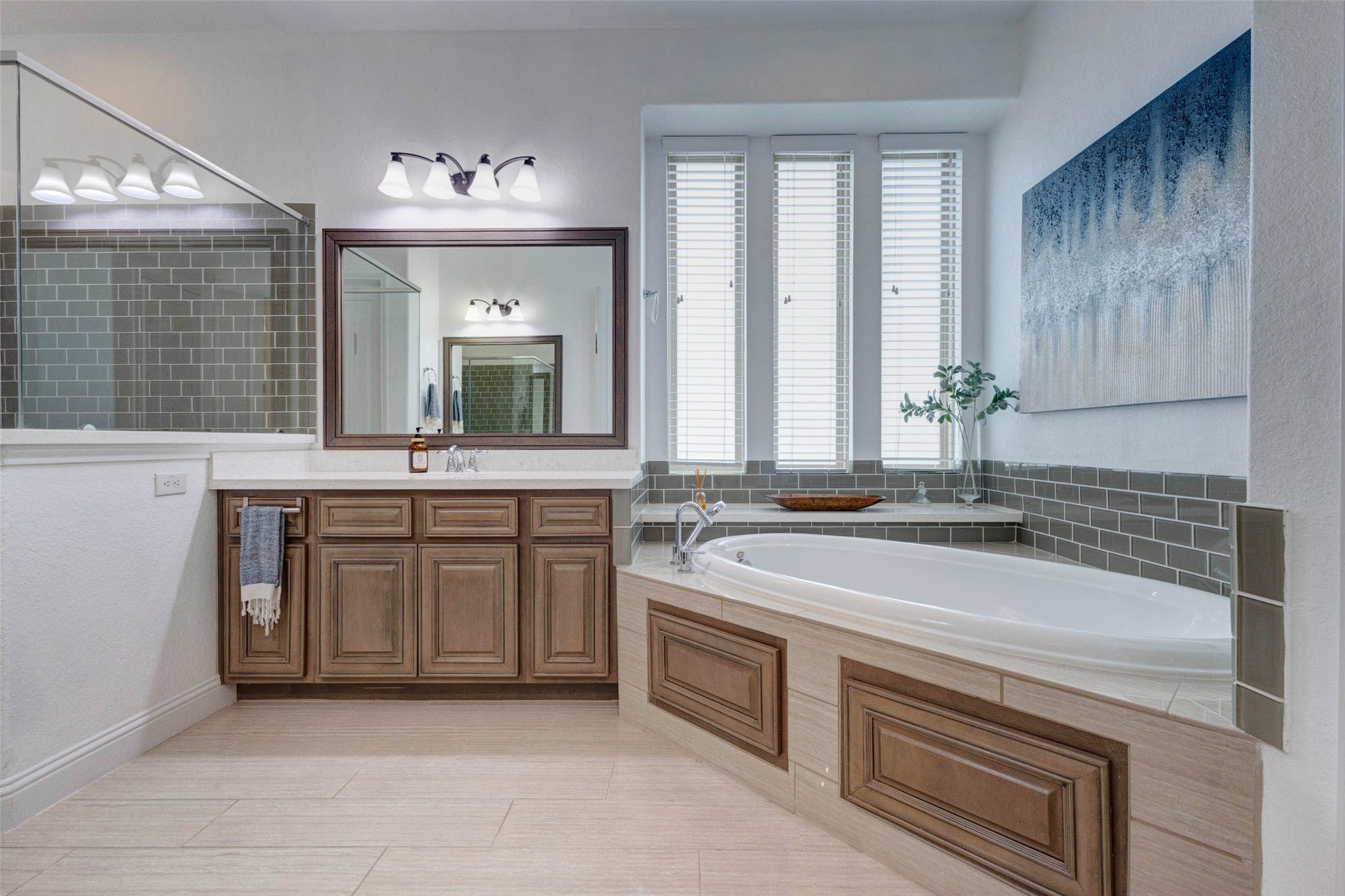 29903 Spring Side Court Fulshear, TX 77406 - Photo 26 of 50 Unwind in the oversized soaking tub surrounded by elegant tilework and natural light from the tall accent windows.