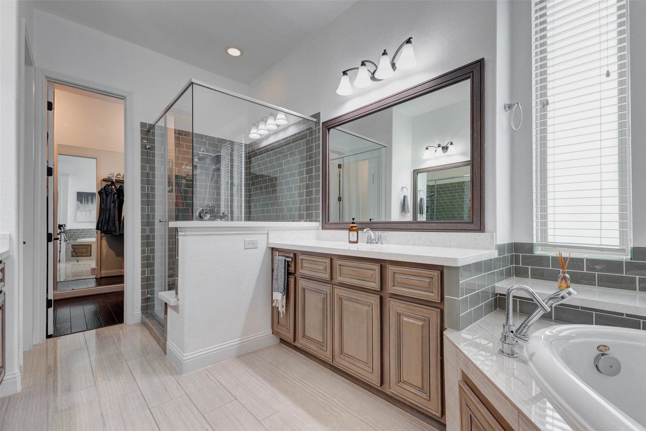 29903 Spring Side Court Fulshear, TX 77406 - Photo 27 of 50 The primary bathroom also features an oversized walk in shower with elegant tile surround and glass enclosure, creating a luxurious spa inspired feel. A full house water softener adds everyday convenience throughout the home.
