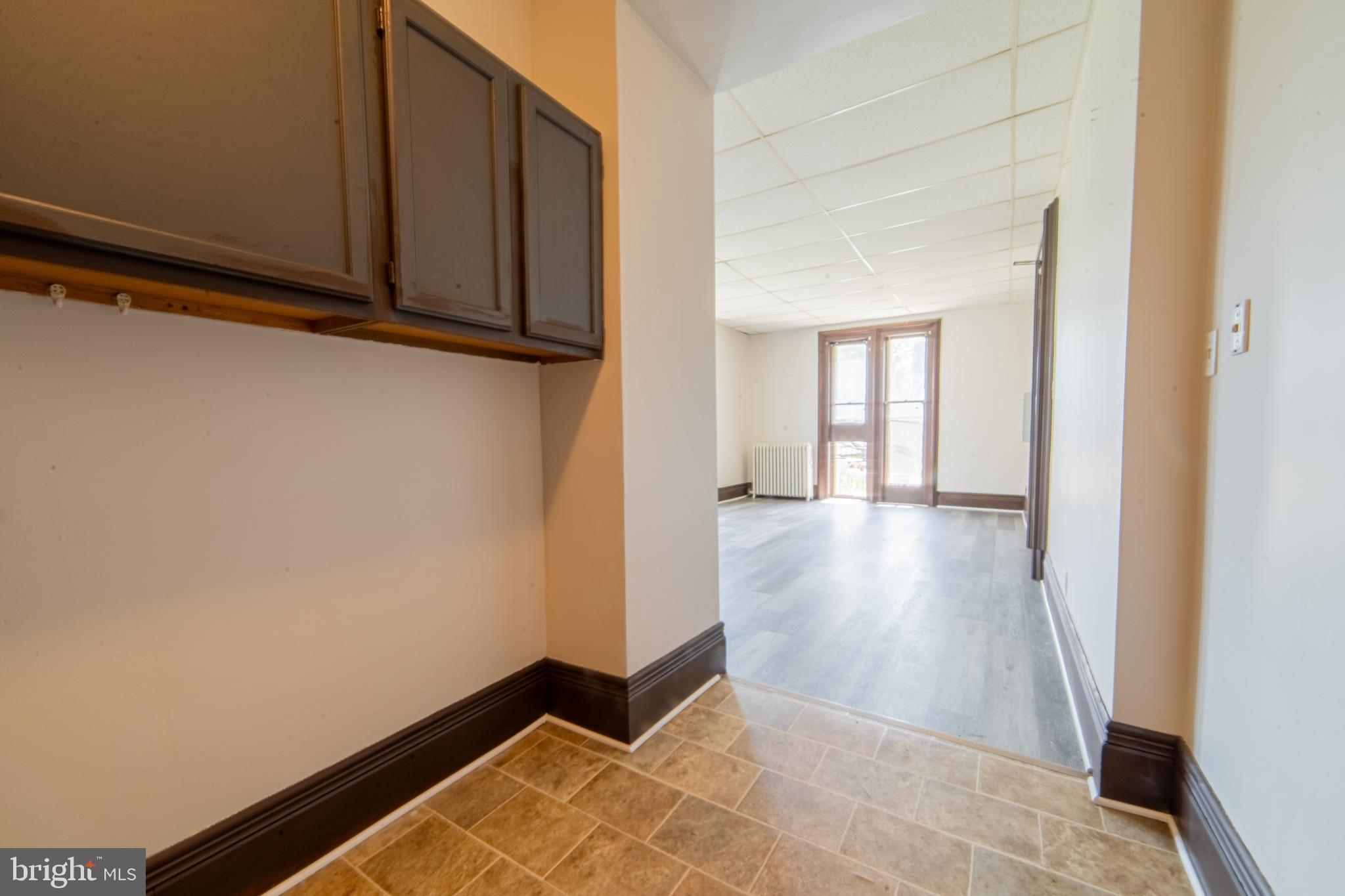 125 West Commerce Street, Unit 2 Bridgeton, NJ 08302 - Photo 2 of 7 a view of a room with wooden floor and cabinet