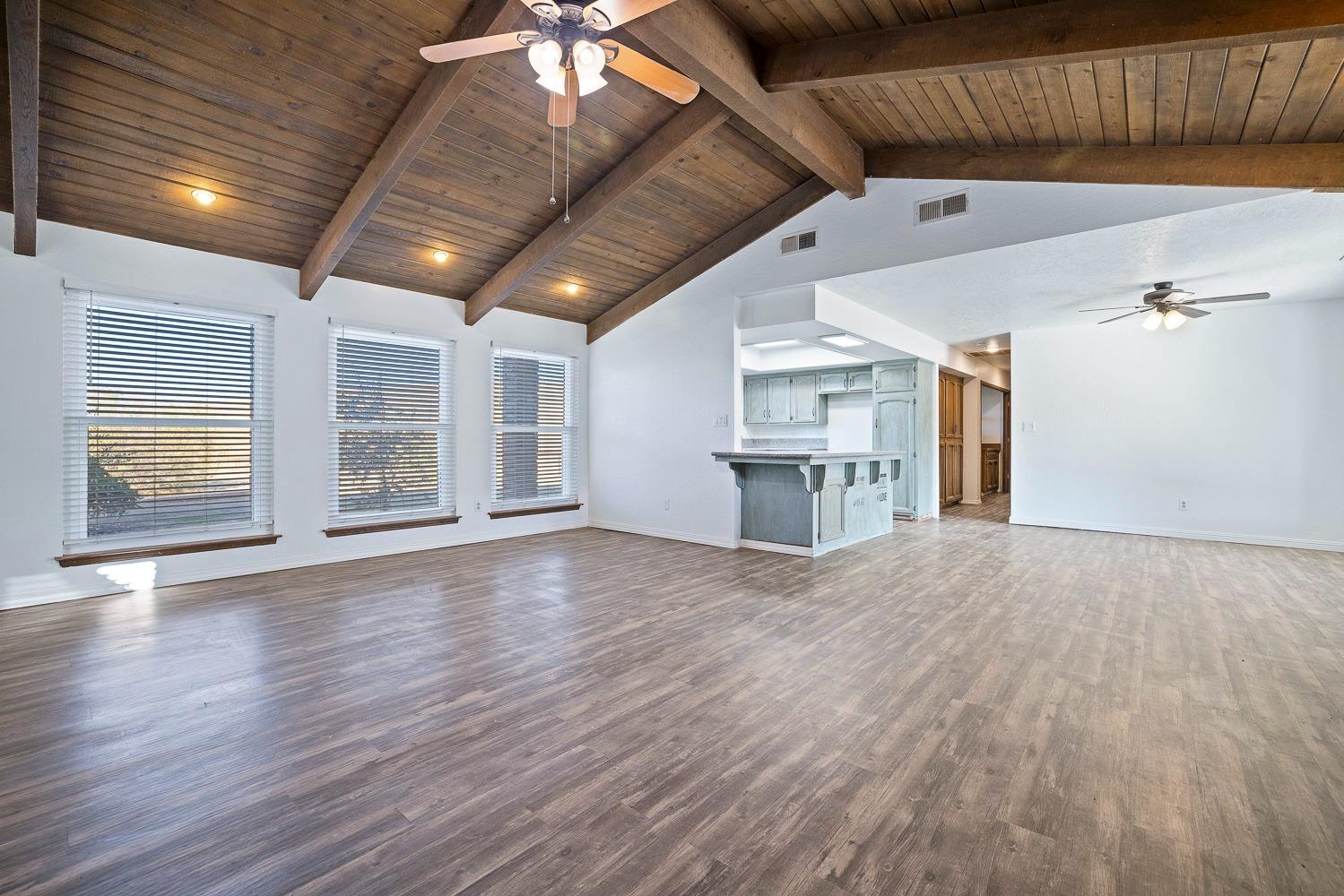 43036 Jacalitos Creek Road Coalinga, CA 93210 - Photo 14 of 85 a view of empty room with wooden floor and fireplace