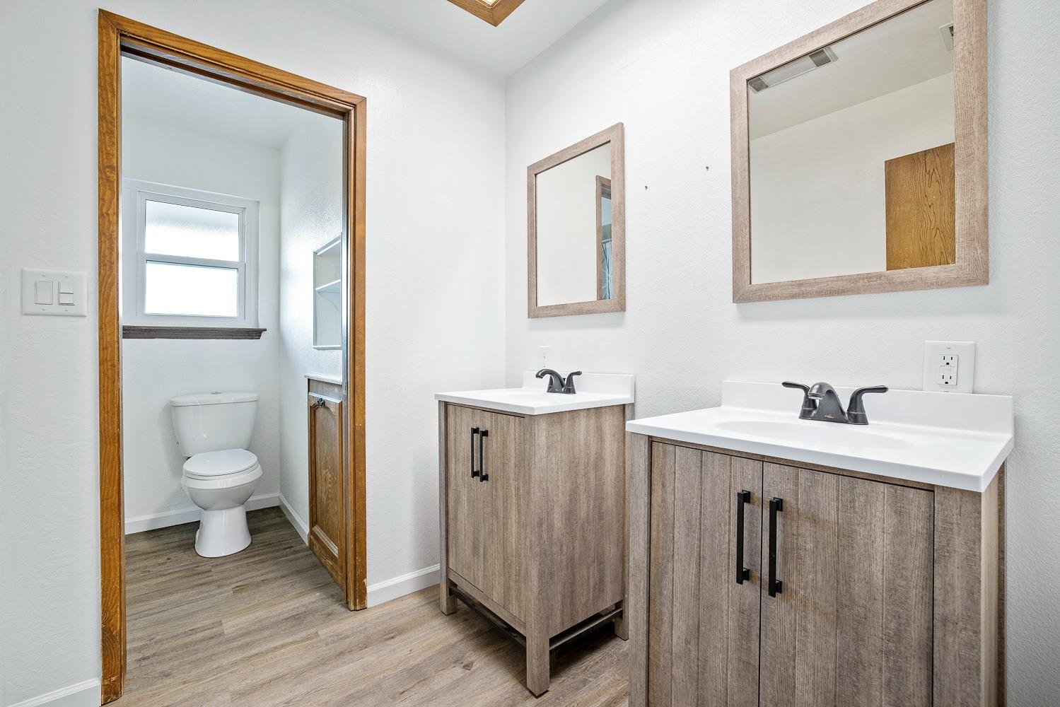 43036 Jacalitos Creek Road Coalinga, CA 93210 - Photo 31 of 85 a bathroom with a sink toilet and mirror