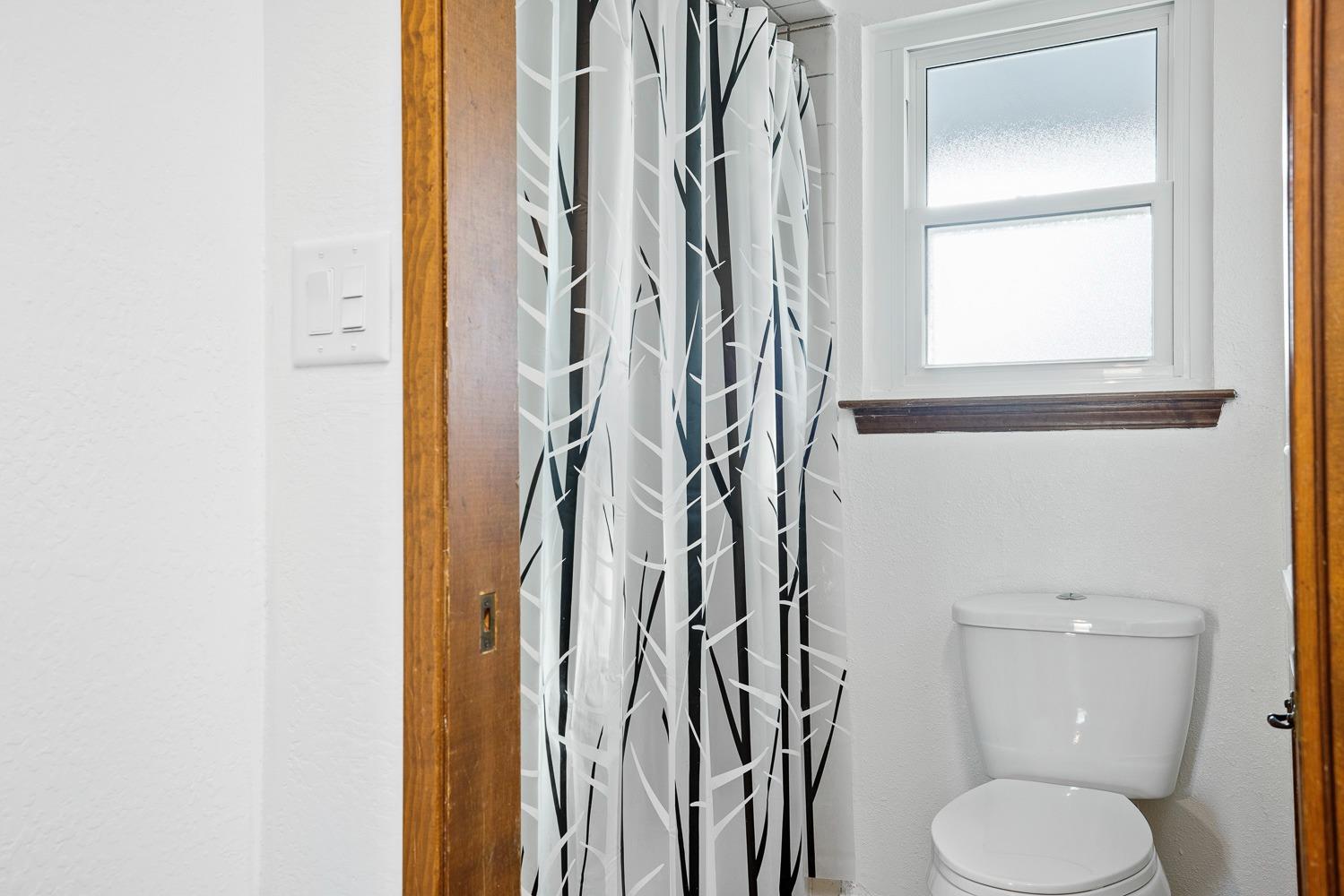 43036 Jacalitos Creek Road Coalinga, CA 93210 - Photo 32 of 85 a white toilet sitting next to a bathroom sink