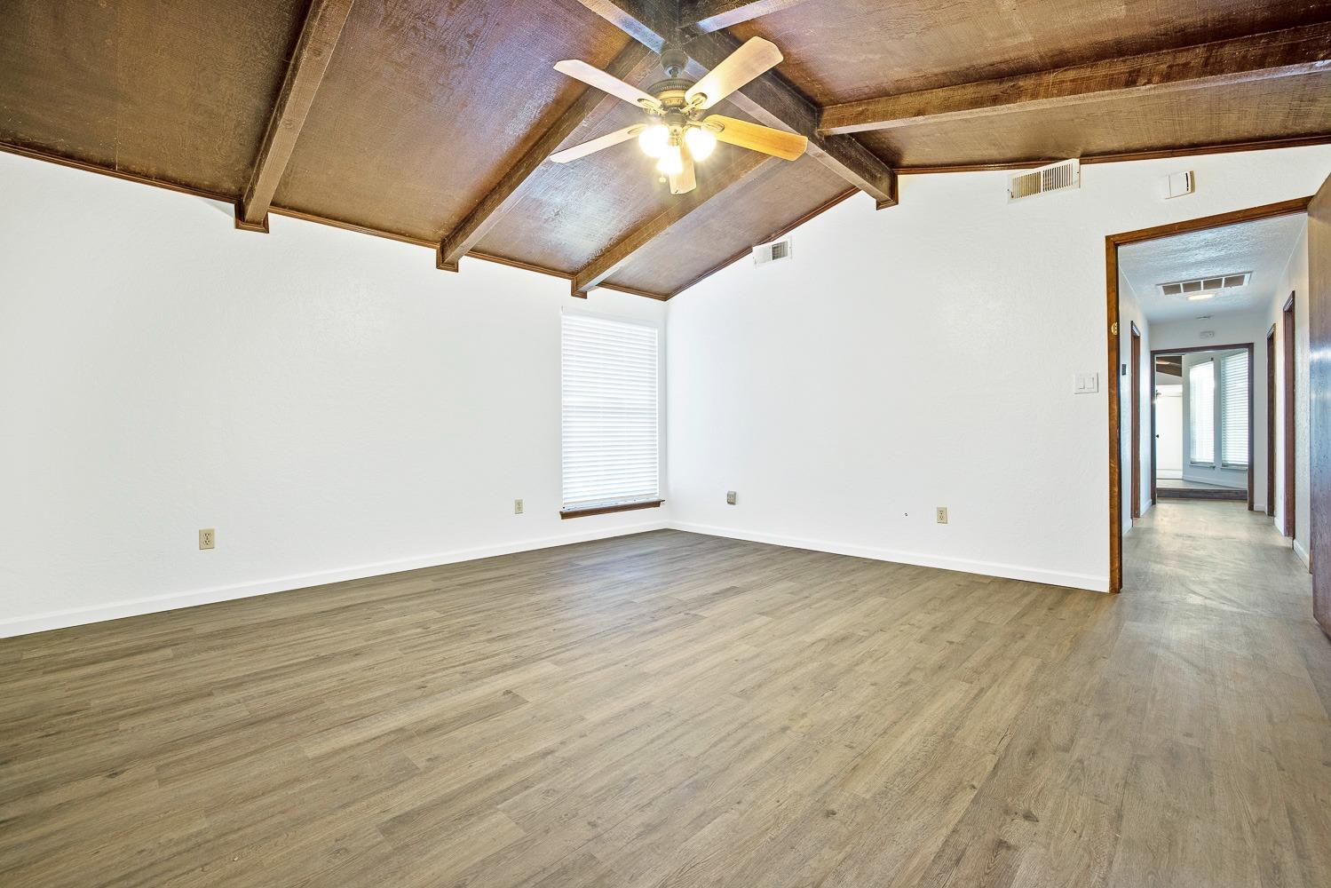 43036 Jacalitos Creek Road Coalinga, CA 93210 - Photo 37 of 85 a view of a room with wooden floor and a ceiling fan
