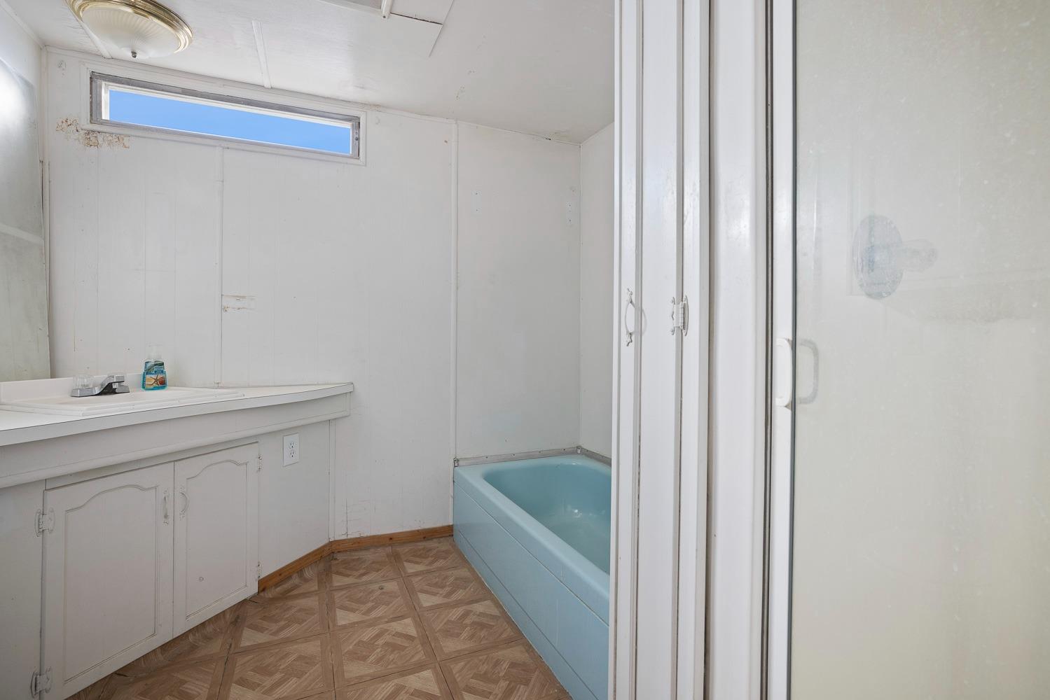 43036 Jacalitos Creek Road Coalinga, CA 93210 - Photo 41 of 85 a bathroom with a sink a toilet and shower