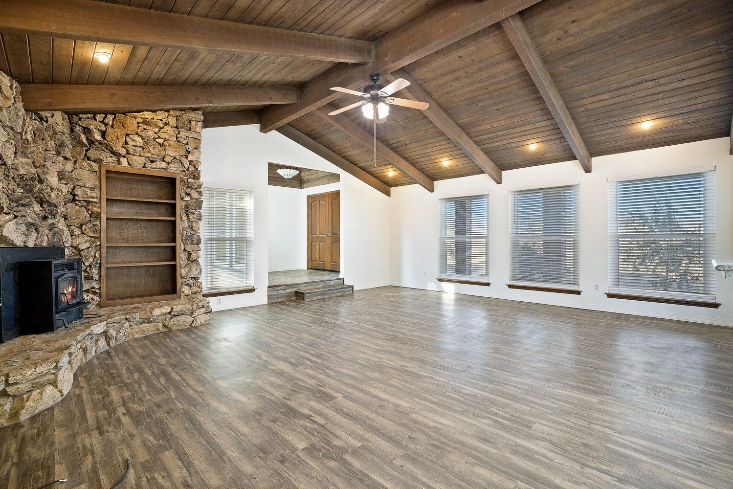 43036 Jacalitos Creek Road Coalinga, CA 93210 - Photo 9 of 85 a view of an empty room with wooden floor and a window