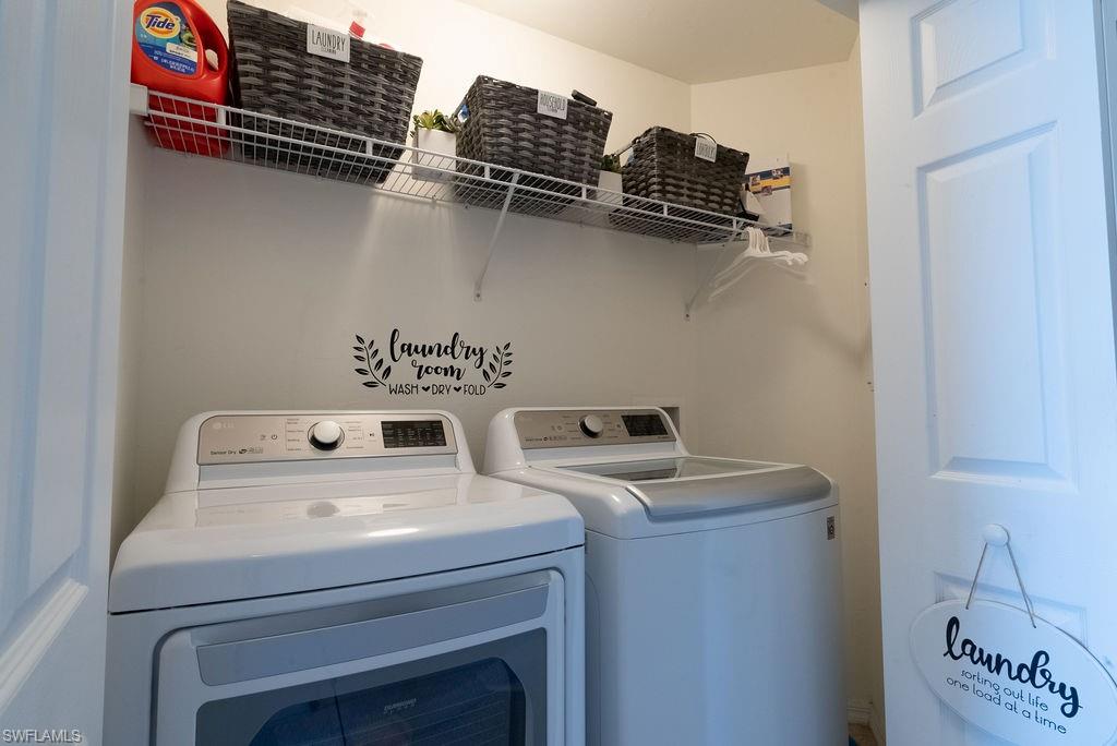 15792 Marcello Circle, Unit 182 Naples, FL 34110 - Photo 17 of 50 a utility room with dryer and washer