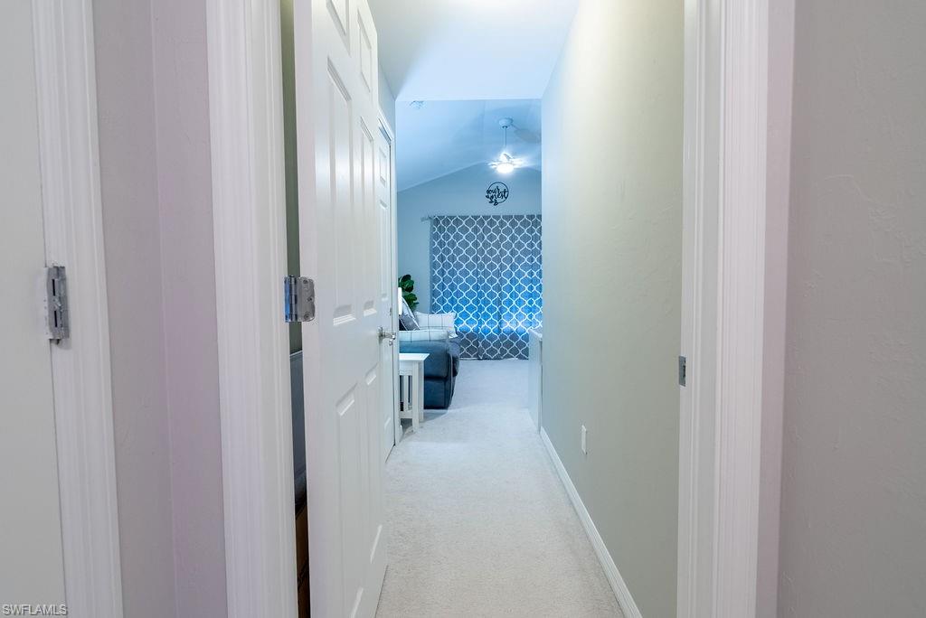 15792 Marcello Circle, Unit 182 Naples, FL 34110 - Photo 23 of 50 a view of a hallway with a room