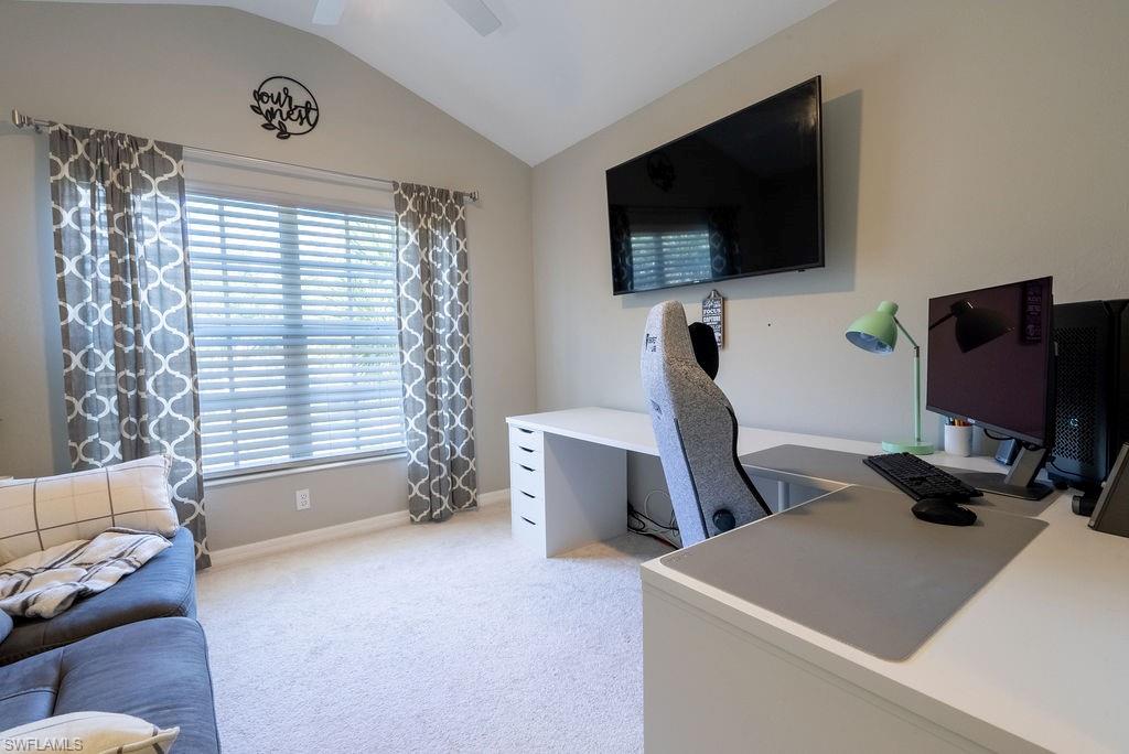 15792 Marcello Circle, Unit 182 Naples, FL 34110 - Photo 25 of 50 a room with furniture and a flat screen tv