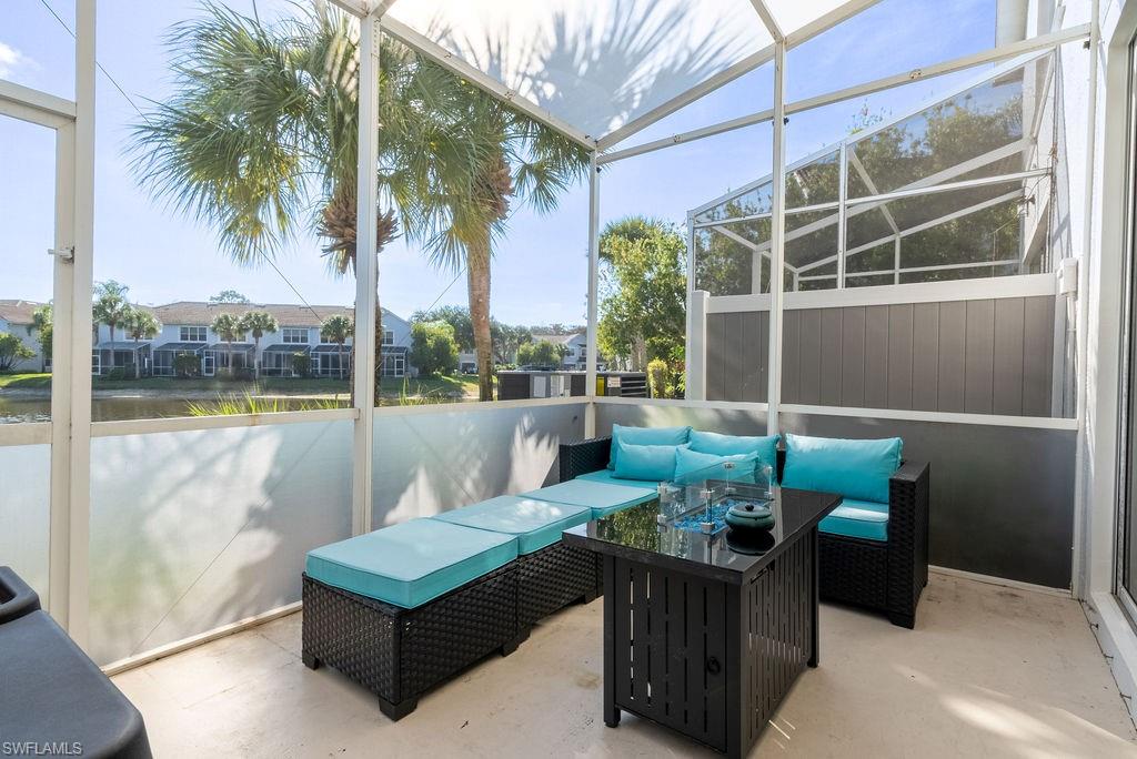 15792 Marcello Circle, Unit 182 Naples, FL 34110 - Photo 43 of 50 a balcony with furniture and a potted plant