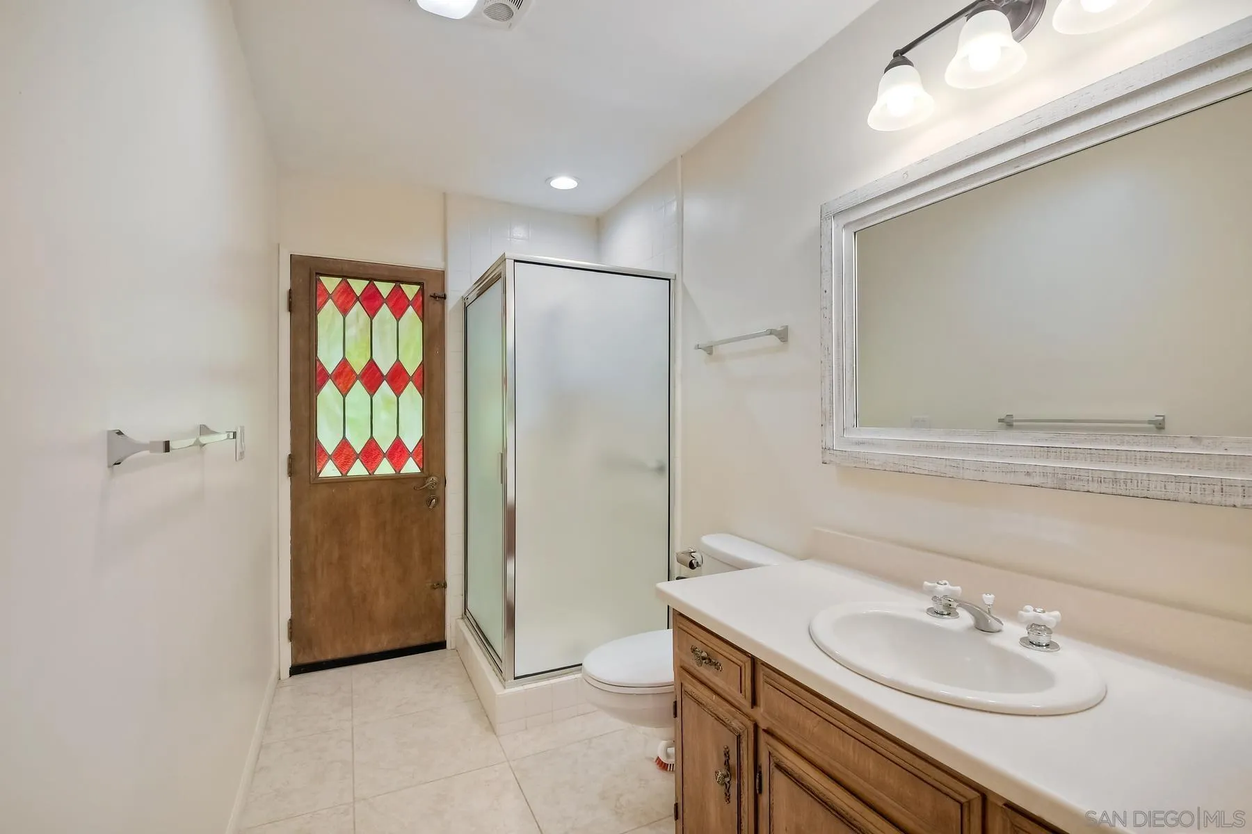 13541 Willow Run Road Poway, CA 92064 - Photo 15 of 40 a bathroom with a sink vanity and a mirror