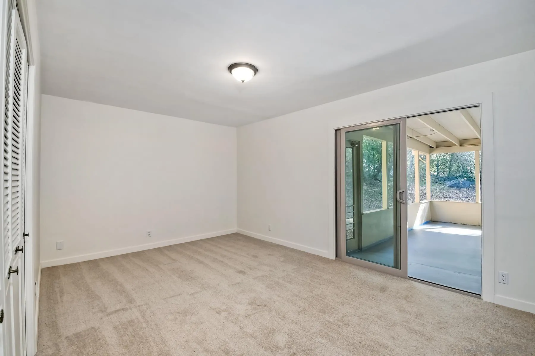13541 Willow Run Road Poway, CA 92064 - Photo 17 of 40 an empty room with glass door