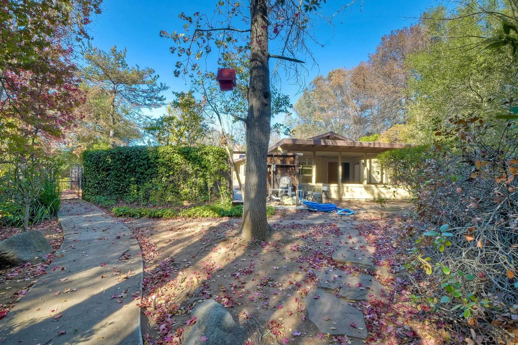 13541 Willow Run Road Poway, CA 92064 - Photo 23 of 40 a front view of a house with garden