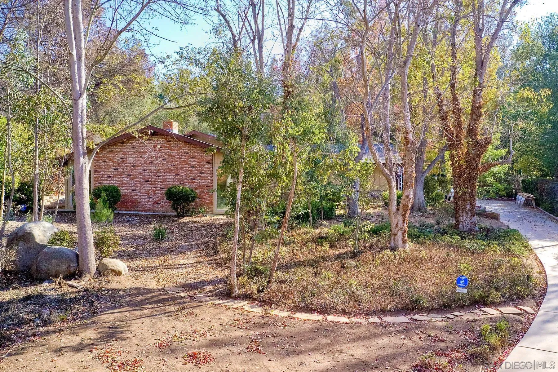 13541 Willow Run Road Poway, CA 92064 - Photo 33 of 40 a view of a garden with a tree