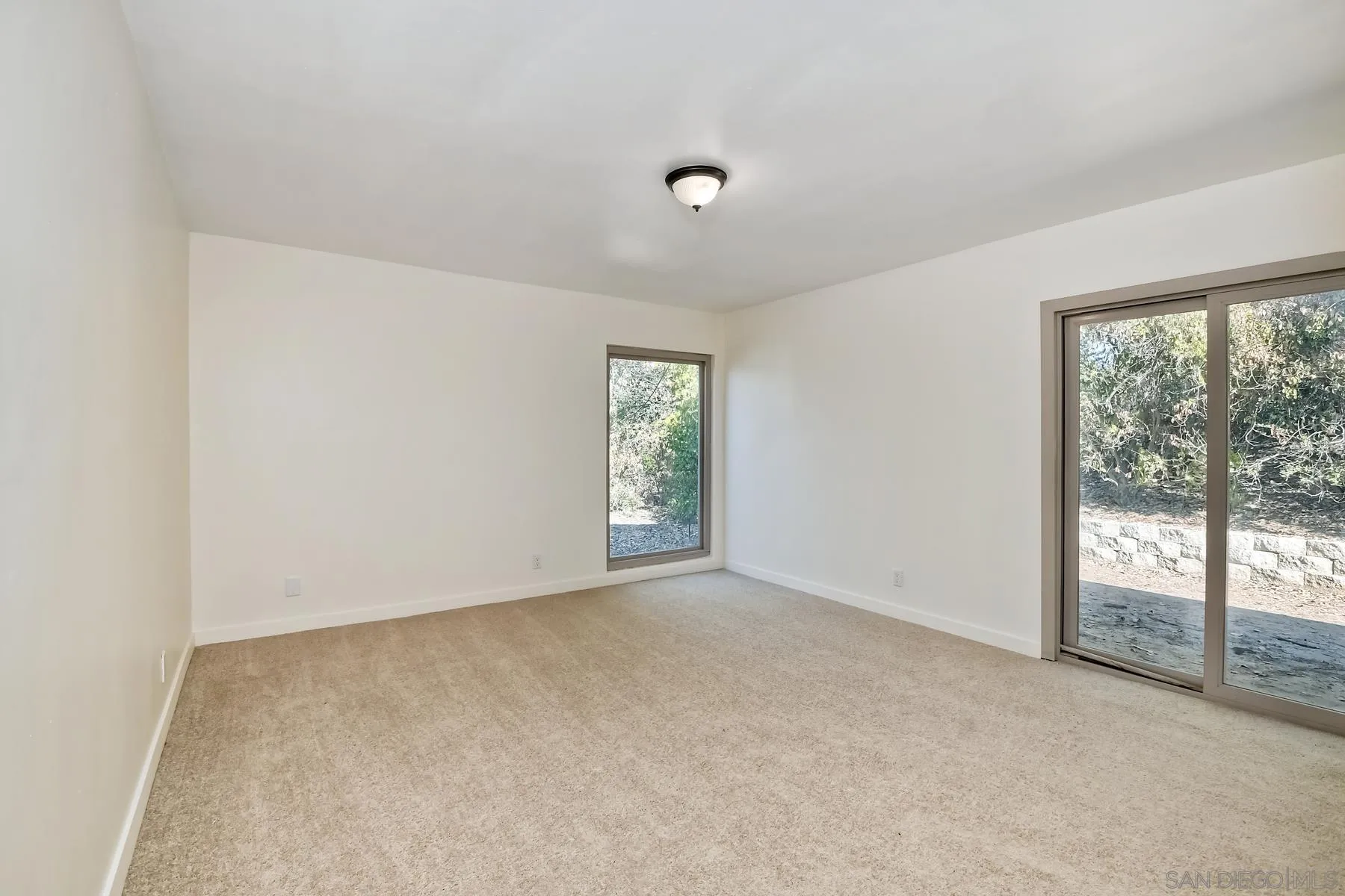 13541 Willow Run Road Poway, CA 92064 - Photo 5 of 40 an empty room with windows