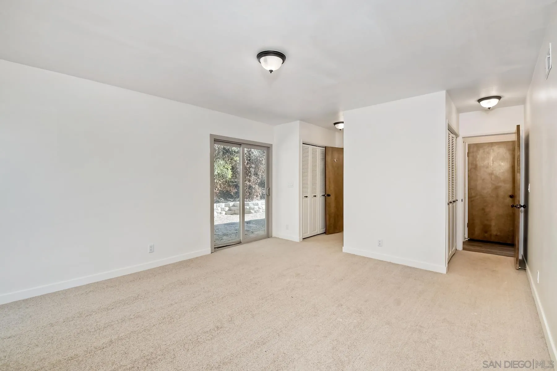 13541 Willow Run Road Poway, CA 92064 - Photo 6 of 40 a view of an empty room with a window