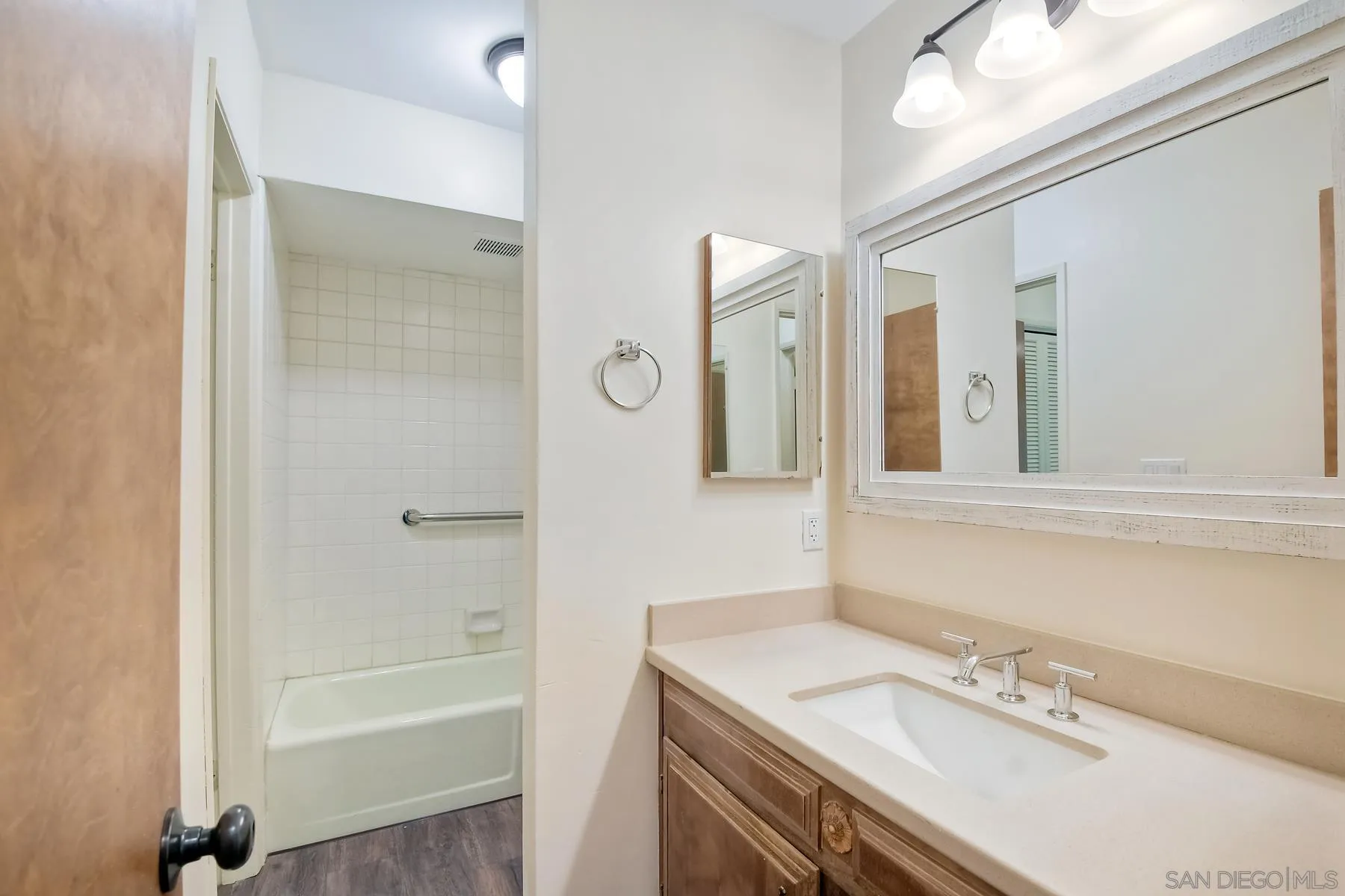 13541 Willow Run Road Poway, CA 92064 - Photo 8 of 40 a bathroom with a sink vanity tub and a mirror