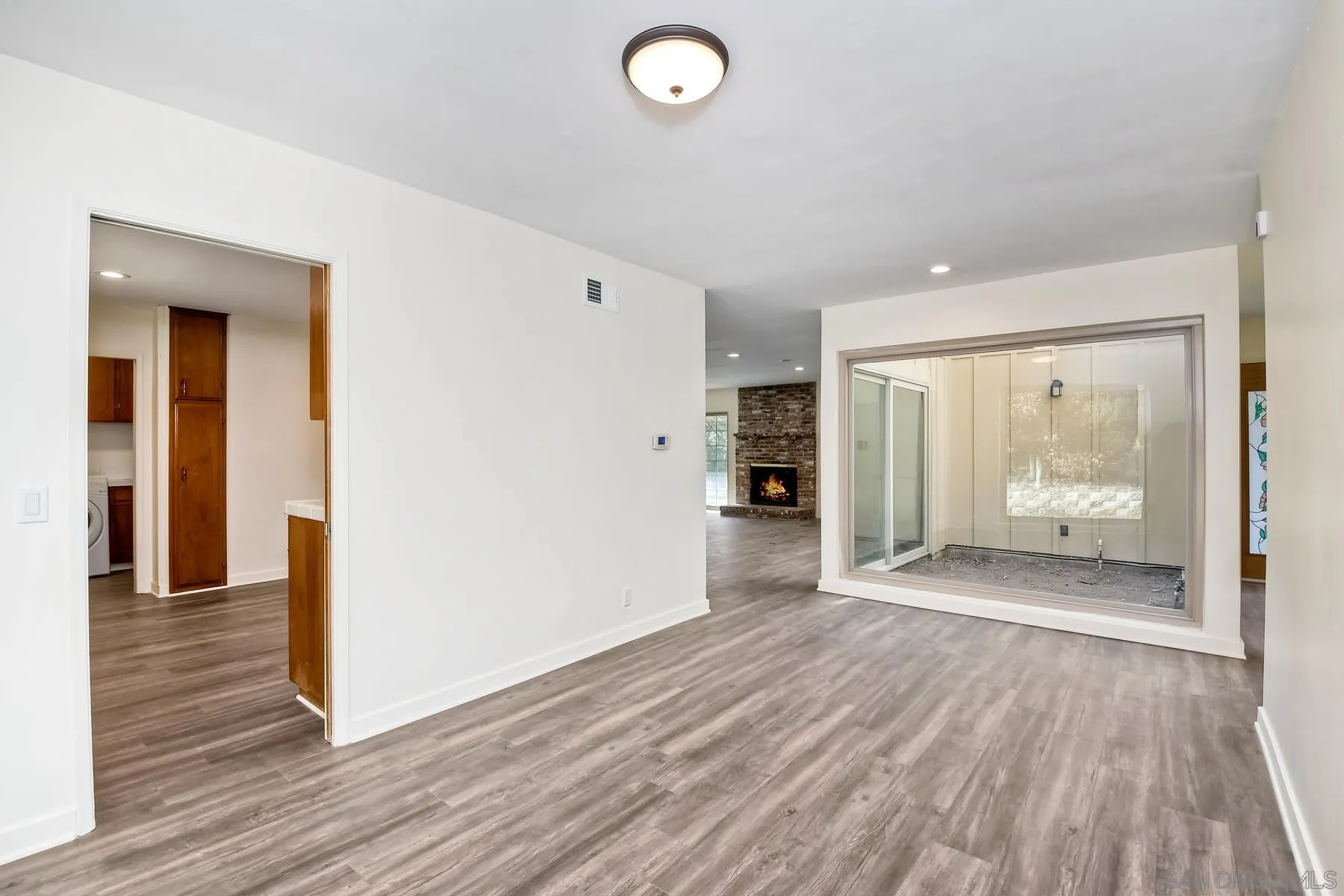 13541 Willow Run Road Poway, CA 92064 - Photo 10 of 40 a view of a room with wooden floor and furniture